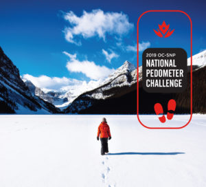 A person walking on a snow-covered lake in a valley surrounded by mountains, with a logo for the 2019 oc-snp national pedometer challenge.